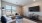 a living room with a tv and couches