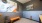 a room with a bench and a poster on the wall